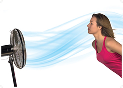 girl staying cool in front of fan